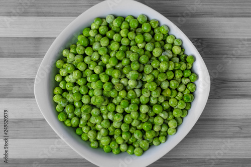 Freshly cooked green peas served in dish. © Sergi