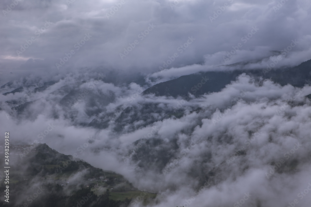 Clouds moving along the mountains on a cloudy day