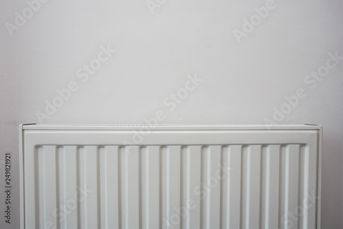 Wallpaper Mural A White heating radiator on the white wall, modern design Torontodigital.ca