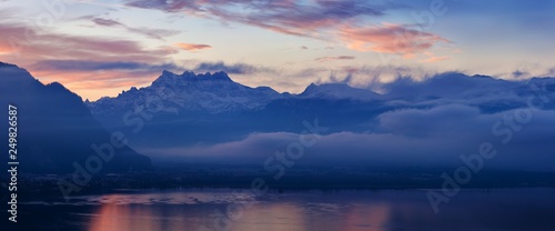 Beautiful view on the side of Geneva lake, with the peaks Dents du Midi of Swiss Alps in background, Montreux, Canton of Vaud, Switzerland Alps on Lake Geneva at Vevey, Switzerland