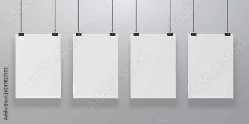 Realistic poster mockup. Blank paper hanging on binders at the wall, empty A4 paper poster clipped on ropes. Vector advertising frames
