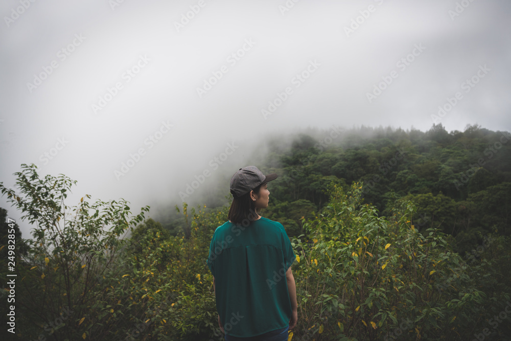 Happy young cute Asian Japanese girl hipster backpack women travelling looking at beautiful sky mountains scenery views Happy young cute Asian Japanese girl hipster backpack women travelling looking at beautiful sky mountains scenery views