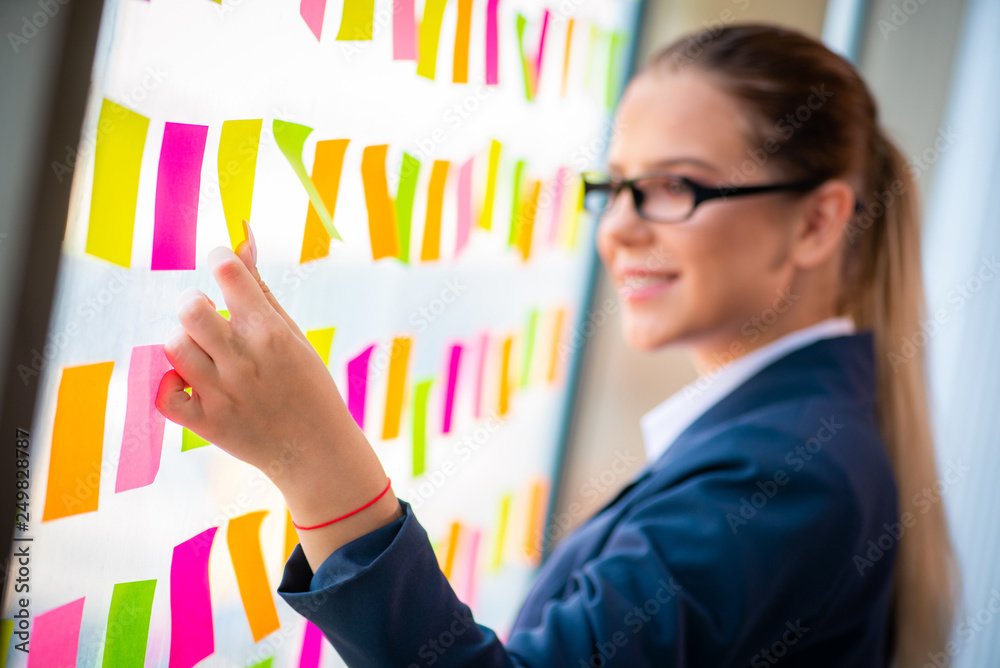 Beautiful female employee with many conflicting priorities Beautiful female employee with many conflicting priorities