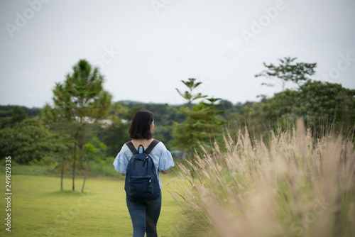 Happy young cute Asian Japanese girl hipster backpack  women travelling looking at beautiful sky mountains scenery views  © Tony