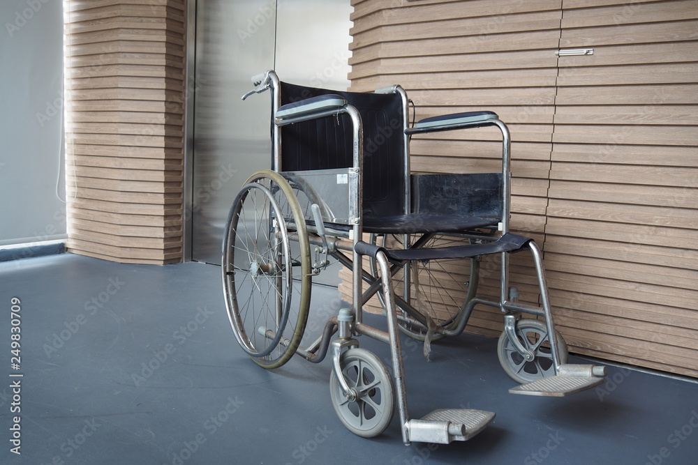 Closed up of patient wheelchair parked in the hospital in front of the lift