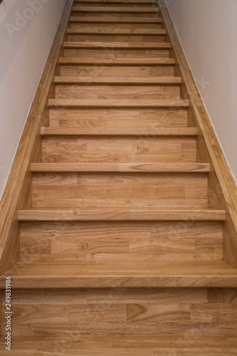 long wooden stairs, modern house interior close-up