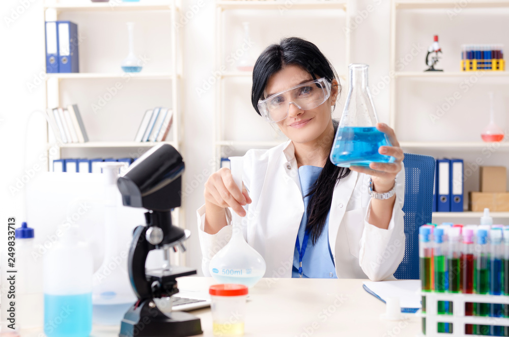 Female chemist working at the lab Female chemist working at the lab