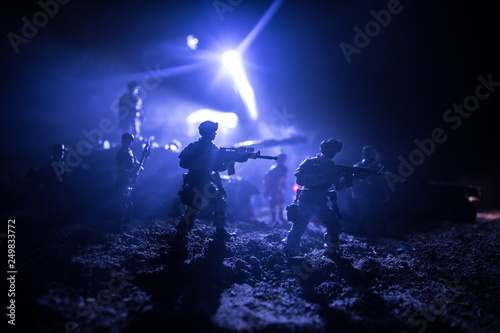 War Concept. Military silhouettes fighting scene on war fog sky background, Fighting silhouettes Below Cloudy Skyline At night. Battle scene. Army vehicle with soldiers. army