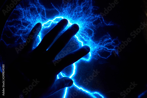 Electric plasma ball on a dark background. Static electricity model