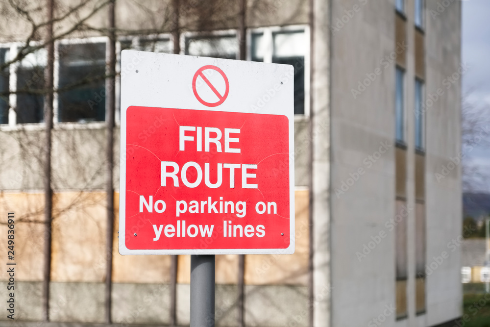 Fire assembly point route sign at office workplace