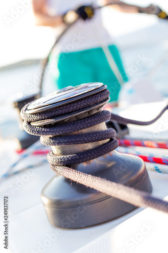 Sailboat winch with rope on yacht deck © Jag_cz