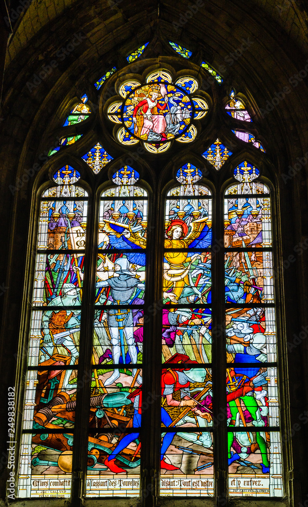 Joan of Arc war scene on colorful stained glass window inside the Cathedral of the Holy Cross in Orleans, Loire Valley, France