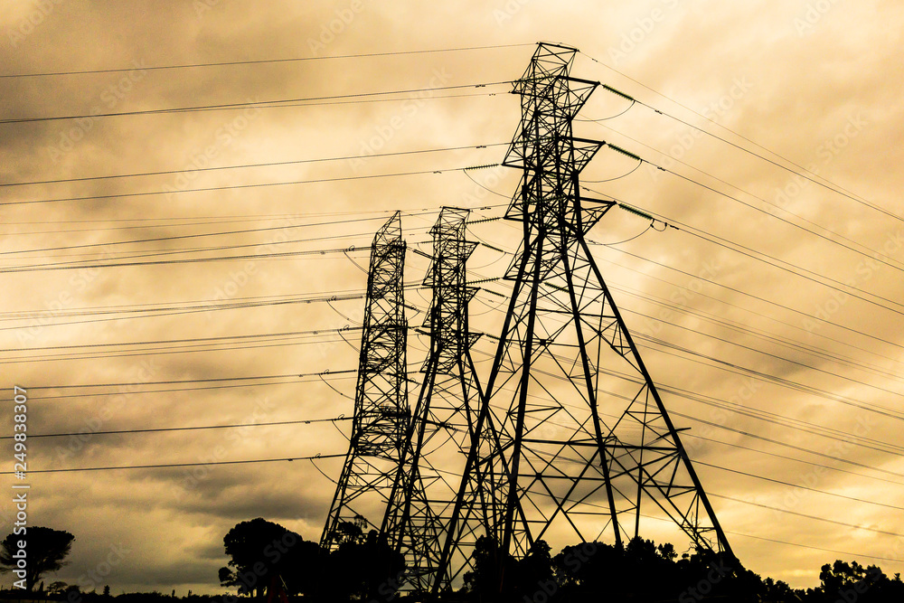 High voltage electricity Pylons and Cables Silhouette Stock Photo ...