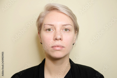 Beauty and fashion concept - Eye lash extension procedure. Young beautiful woman eye with long false eyelashes. Close up macro shot of fashion eyes in beauty salon.