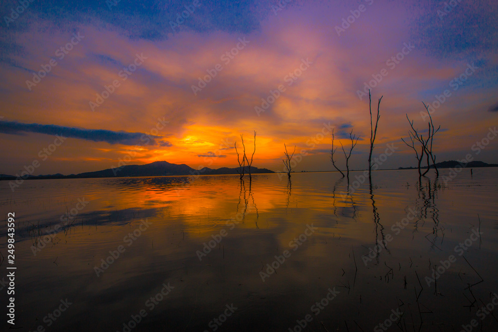 An abstract background of colorful, evening sky on the lake, beautiful in nature, with an artistic beauty. An abstract background of colorful, evening sky on the lake, beautiful in nature, with an artistic beauty.