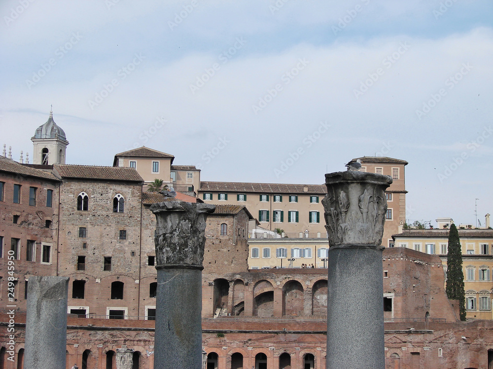 Forum of Cesari in Rome with Trajan's Column and church in background