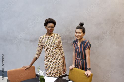 Portrait of black African businesswoman and Asian female professional colleague