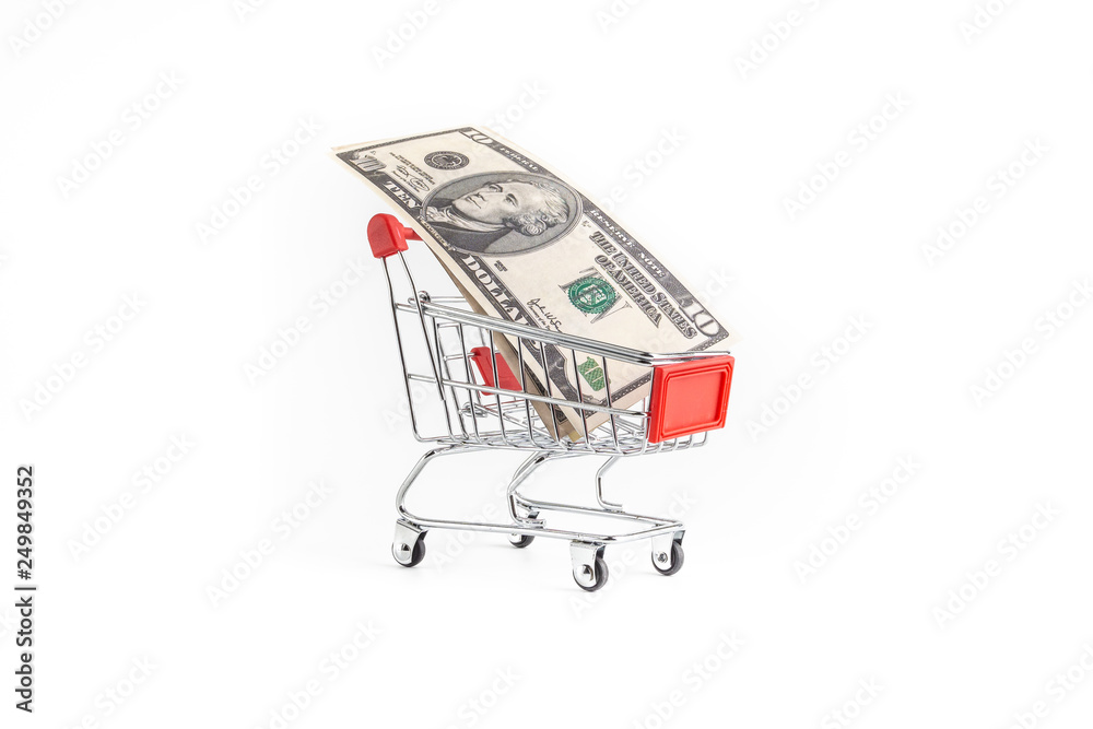 Shopping cart and dollar or USD notes isolated on white background , business , shopping concept. Selective focus