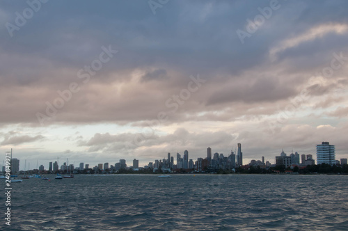 Wide angle evening scene of skyscrapers horizon with ocean and tall office and residential towers in Melbourne Australia © eyeofpaul