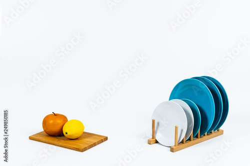 Tidy various kitchen tools and fruits or flowers on the white background.