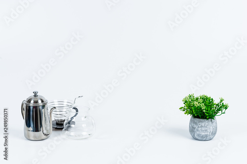 Tidy various kitchen tools and fruits or flowers on the white background.