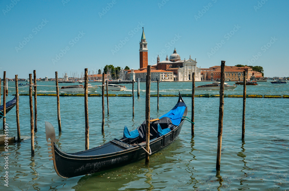 Gondola in Venice. Church of San Giorgio Maggiore with gondolas, Venice, Italy