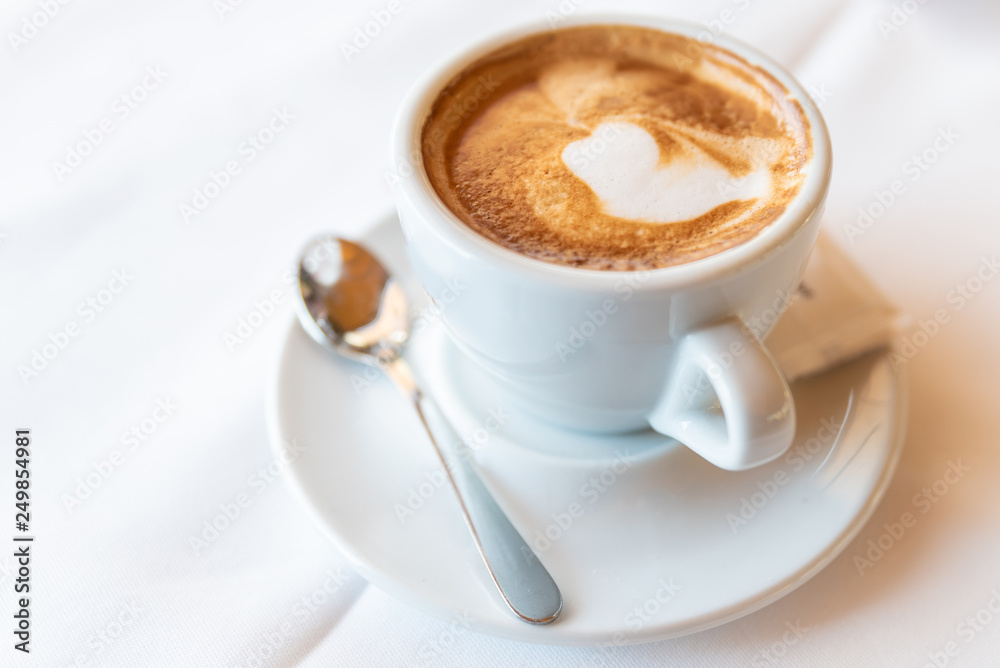 A long espresso coffee in a white cup A long espresso coffee in a white cup