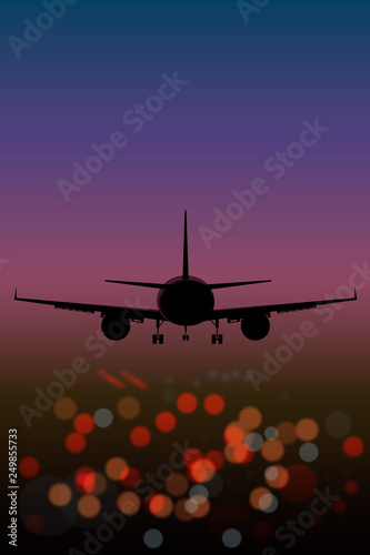  airplane on the background lights of the night city bokeh effect top view at sunset