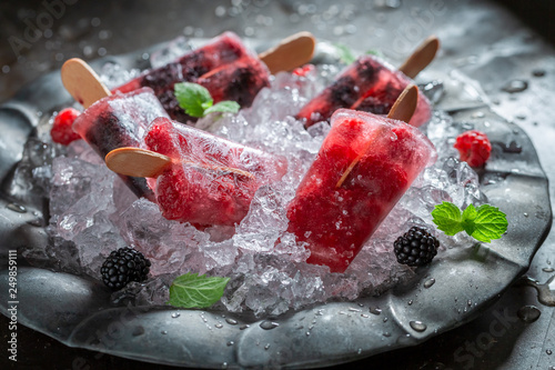 Fresh berry fruits ice cream on cold ice