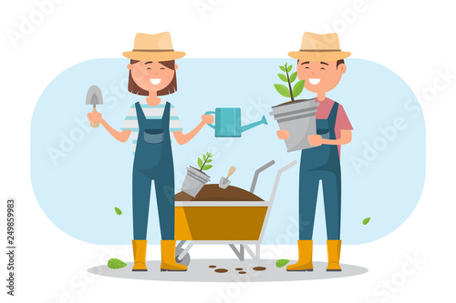 happy boy and girl planting a tree outdoors