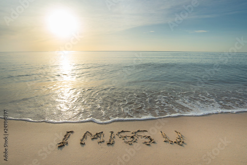 Fototapeta Naklejka Na Ścianę i Meble -  sand beach in the morning sunrise and there is a letter that i miss u. an idea of Lonely and nostalgic. 