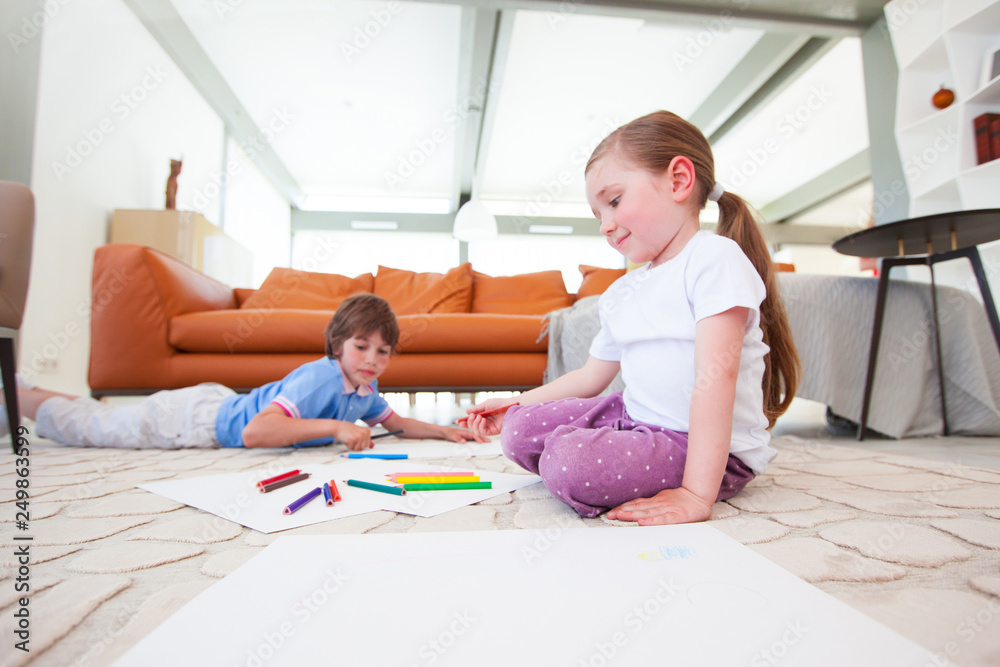 Children drawing with color pencils Children drawing with color pencils