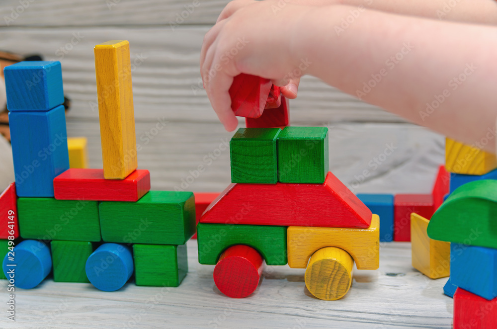 Children's wooden designer from blocks of a different form