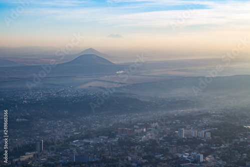 Beautiful city with mountain in the haze photo