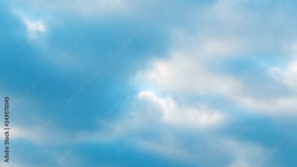 White and gray fluffy clouds quickly fly past the horizon. Time concept White and gray fluffy clouds quickly fly past the horizon. Time concept