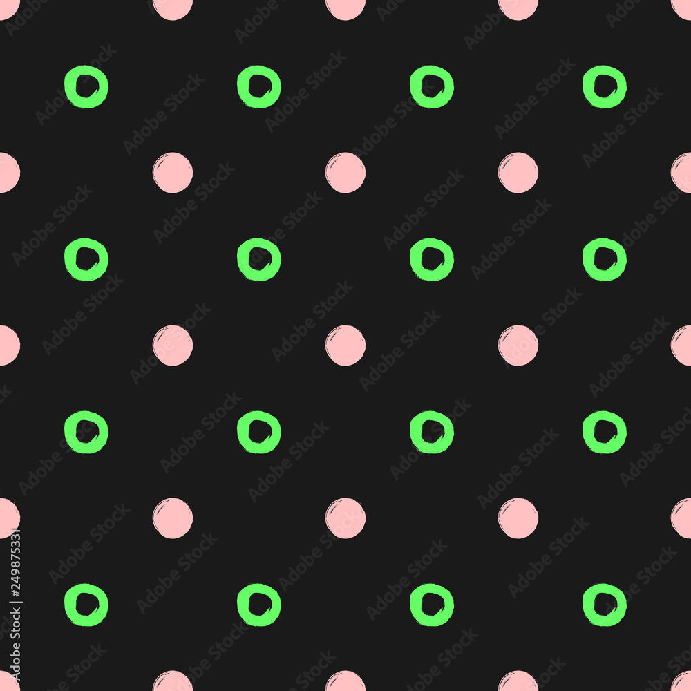 Repeated circles and round spots drawn by hand with a rough brush. Simple seamless pattern. Sketch, watercolor, paint. Black, green, pink.