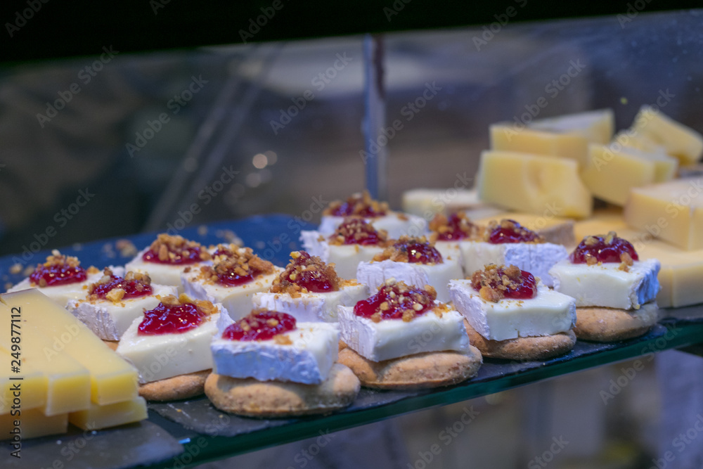 Mini sandwiches food set. Brushetta or authentic traditional spanish tapas for lunch table. Delicious snack, appetizer, antipasti in San Miguel Market, Madrid, Spain