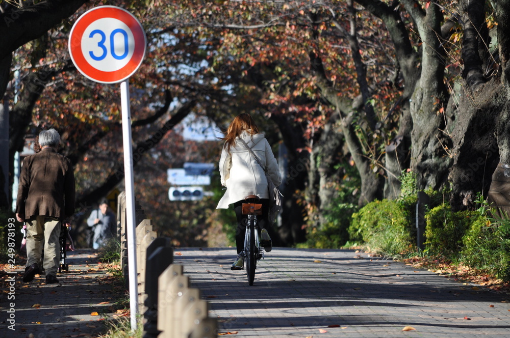 Woman on bike in Tokyo Japan