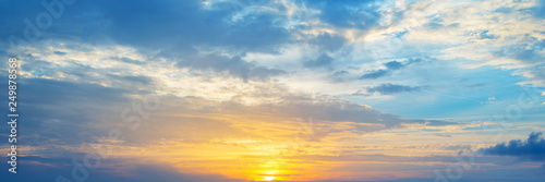 Fototapeta Naklejka Na Ścianę i Meble -  Panoramic view of a cloudy sky at sunset