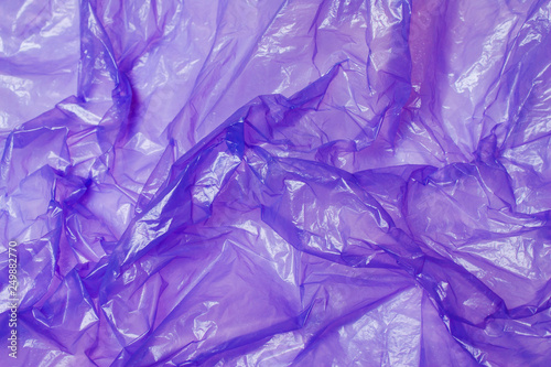 Purple plastic bag. The concept of using environmentally friendly packaging © alexmia
