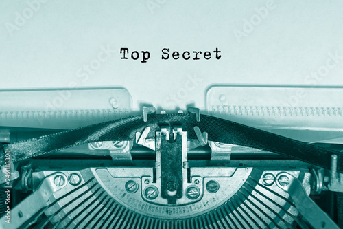 Top Secret printed on a piece of paper on a vintage typewriter.  writer, journalist.