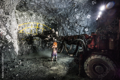 Drilling to place explosives at an underground tunnel at a copper mine in NSW Australia photo