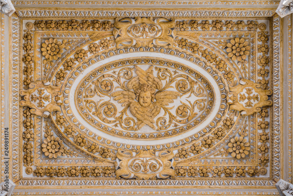 Stucco decoration in the ceiling of the portico in Saint Peter Basilica in Rome, Italy.