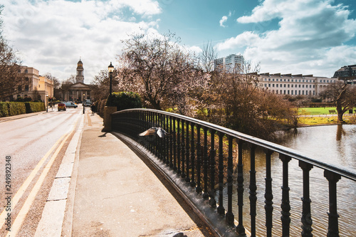Spring scene on York Bridge in Regent's Park with a view towards Saint Marylebone church