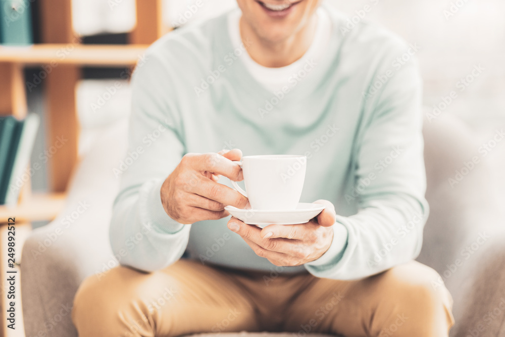 Man feeling relaxed while enjoying tea break Man feeling relaxed while enjoying tea break
