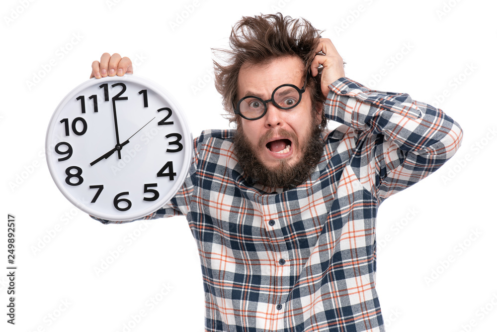 Crazy bearded Man in plaid shirt with funny Haircut in eye Glasses holding Big Clock, isolated on white background. Time concept. Crazy bearded Man in plaid shirt with funny Haircut in eye Glasses holding Big Clock, isolated on white background. Time concept.