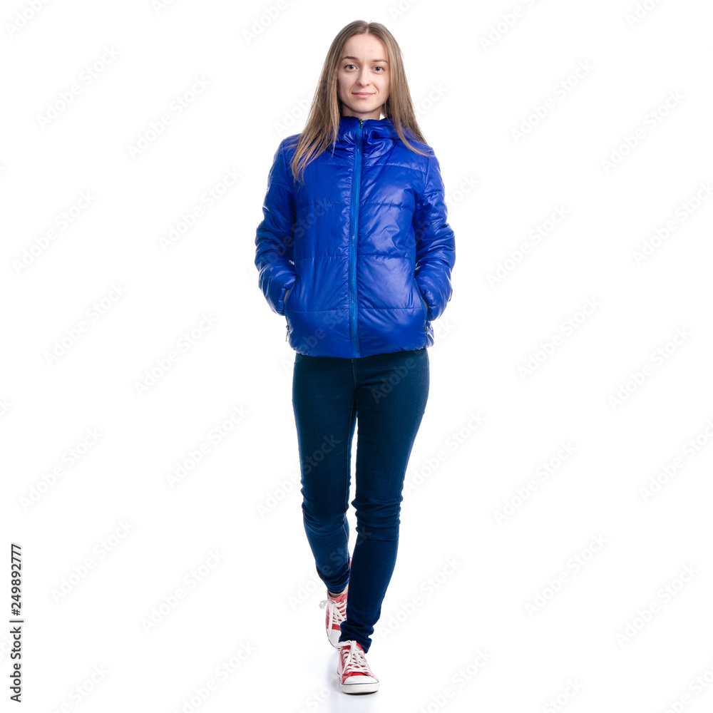 Woman in jeans and jacket walking goes on white background. Isolation ...