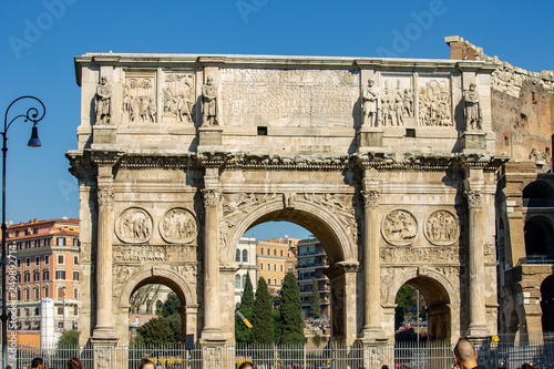 Rome Italy. The symbol of the city of Rome, the Colosseum, with all its "windows" on the sky, the nearby Arch of Constantine with the seagulls that inhabit it.