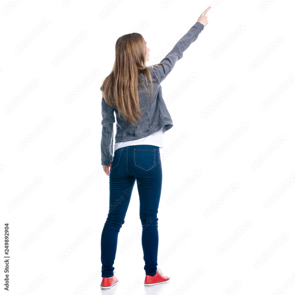 Woman in jeans shoowing pointing on white background. Isolation, back view Woman in jeans shoowing pointing on white background. Isolation, back view