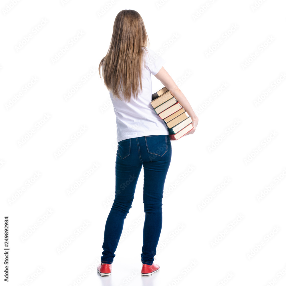 © Kabardins photo - Woman in jeans stack of books in hand on white background isolation, back view
